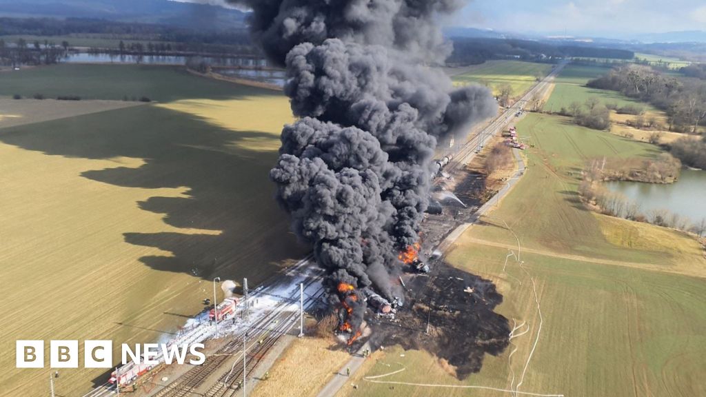 Firefighters tackle a large poisonous train fire